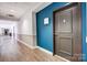A well-lit hallway features two-tone walls and apartment doors at 720 Governor Morrison St # 207, Charlotte, NC 28211