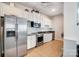 Modern kitchen features stainless steel appliances, sleek cabinets, and tile flooring for a clean and stylish look at 720 Governor Morrison St # 207, Charlotte, NC 28211