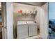 Laundry area featuring a washer and dryer located inside of a closet at 720 Governor Morrison St # 207, Charlotte, NC 28211