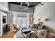 Spacious living room featuring hardwood floors, large windows, high ceilings, fireplace and modern decor at 720 Governor Morrison St # 207, Charlotte, NC 28211