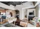 Inviting living room with modern decor, hardwood floors, a fireplace, and open access to other rooms at 720 Governor Morrison St # 207, Charlotte, NC 28211