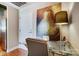 Hallway office featuring a glass desk with a modern lamp next to the kitchen at 720 Governor Morrison St # 207, Charlotte, NC 28211