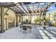 Cozy outdoor patio with a fireplace, dining area, and pergola, ideal for entertaining and relaxation at 720 Governor Morrison St # 207, Charlotte, NC 28211