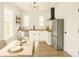 Eat-in kitchen featuring stainless steel appliances, butcher block countertops, and modern lighting at 720 Holmes St, Salisbury, NC 28144