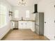 Well-lit kitchen with stainless steel appliances, butcher block countertops, and stylish lighting at 720 Holmes St, Salisbury, NC 28144