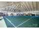 Open-air community basketball court with green surface and covered structure at 805 Deep River Way, Waxhaw, NC 28173