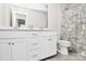 Well-lit bathroom with a double vanity, white cabinets, and a shower-tub combo at 805 Deep River Way, Waxhaw, NC 28173