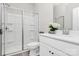 Clean bathroom featuring a glass shower, white vanity with countertop, and modern fixtures at 805 Deep River Way, Waxhaw, NC 28173