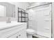 A bathroom with a glass-enclosed shower, white vanity, and sleek fixtures at 805 Deep River Way, Waxhaw, NC 28173