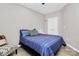 Comfortable bedroom featuring a queen size bed, patterned chair and plenty of closet space at 805 Deep River Way, Waxhaw, NC 28173