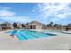 Community pool with a lap lane and lounge area surrounded by modern homes at 805 Deep River Way, Waxhaw, NC 28173