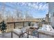 Relaxing outdoor deck with comfortable seating and beautiful views of the surrounding landscape at 805 Deep River Way, Waxhaw, NC 28173