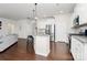 Modern kitchen featuring stainless steel appliances, granite countertops, and an island with bar seating at 805 Deep River Way, Waxhaw, NC 28173