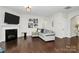 Cozy living room with hardwood floors, fireplace, and neutral decor at 805 Deep River Way, Waxhaw, NC 28173