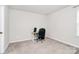 Neutral office space with a modern desk, chair, and natural light from the window at 805 Deep River Way, Waxhaw, NC 28173