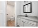This bathroom features a granite-topped vanity with ample cabinet storage and modern fixtures at 8057 Cedar Glen Dr, Charlotte, NC 28212