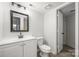 Bathroom featuring modern vanity, toilet, and framed mirror at 8057 Cedar Glen Dr, Charlotte, NC 28212