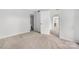 Bedroom with neutral walls, carpet, and bathroom access at 8057 Cedar Glen Dr, Charlotte, NC 28212