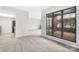 View of open concept living room with access to kitchen and view through large windows at 8057 Cedar Glen Dr, Charlotte, NC 28212