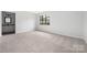 Spacious main bedroom featuring a large window and a connected bathroom at 8057 Cedar Glen Dr, Charlotte, NC 28212
