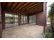 This covered patio features dual glass sliding doors accessing the home's interior for seamless indoor-outdoor living at 8057 Cedar Glen Dr, Charlotte, NC 28212
