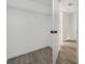 A simple walk-in closet space is enhanced by the neutral walls and wire shelving at 8057 Cedar Glen Dr, Charlotte, NC 28212