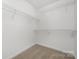 Spacious walk-in closet with multiple wire shelves provides ample storage space in this home at 8057 Cedar Glen Dr, Charlotte, NC 28212