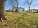 Expansive backyard with mature trees offers space for outdoor activities at 811 Austin St, Albemarle, NC 28001