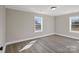 Neutral bedroom with two windows providing ample natural light and view of the outdoors at 811 Austin St, Albemarle, NC 28001