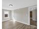 Neutral bedroom with hardwood floors and view of the ensuite bath at 811 Austin St, Albemarle, NC 28001
