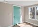 Inviting entryway featuring a modern blue front door and sunlight streaming through the side window at 811 Austin St, Albemarle, NC 28001