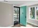 A charming doorway with an intriguing blue door and a glimpse of the neighborhood at 811 Austin St, Albemarle, NC 28001