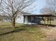 Home exterior featuring a covered porch, side entrance, and well-maintained lawn at 915 Chapel St, Landis, NC 28088