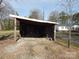 Wood shed providing storage and a view of the surrounding yard at 915 Chapel St, Landis, NC 28088