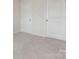 Bedroom with plush carpeting and two doors, perfect for creating a cozy retreat at 1011 20Th Avenue Se Loop, Hickory, NC 28602