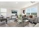 Inviting living room featuring a comfortable sofa, decorative pillows, and a large window offering natural light at 1011 20Th Avenue Se Loop, Hickory, NC 28602