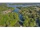 Expansive aerial view of a lake community surrounded by lush greenery, showcasing waterfront homes and docks at 106 Mcnaron Ln, Mooresville, NC 28117