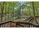 Expansive backyard with decks leading to a private boat dock, offering stunning views of the lake at 106 Mcnaron Ln, Mooresville, NC 28117
