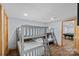 Bedroom with triple bunk beds and view into adjacent game room with pool table at 106 Mcnaron Ln, Mooresville, NC 28117