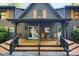 Inviting front porch with rocking chairs and a swing, perfect for relaxing in this log home at 106 Mcnaron Ln, Mooresville, NC 28117