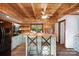 Charming kitchen with wood ceiling, stainless appliances, breakfast bar, and view to the outside at 106 Mcnaron Ln, Mooresville, NC 28117
