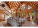 Open living area with vaulted ceilings, exposed beams, and comfortable seating at 106 Mcnaron Ln, Mooresville, NC 28117