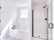 Bright bathroom featuring a tub, shower, and modern fixtures at 107 Megby Trl, Statesville, NC 28677