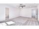 Large bedroom with ceiling fan, carpet, and attached bathroom at 107 Megby Trl, Statesville, NC 28677