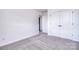 Bright bedroom featuring neutral carpet and double closets at 107 Megby Trl, Statesville, NC 28677