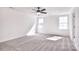 Spacious bedroom with ample natural light and neutral carpet at 107 Megby Trl, Statesville, NC 28677