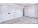 Bright bedroom featuring neutral carpet, double closets and fresh white walls at 107 Megby Trl, Statesville, NC 28677