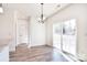 Dining room featuring a modern light fixture and sliding glass doors to the backyard at 107 Megby Trl, Statesville, NC 28677