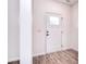 Entryway with a white front door and neutral walls, showcasing the clean and modern aesthetic at 107 Megby Trl, Statesville, NC 28677