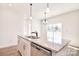 Kitchen island featuring a stainless steel dishwasher, granite counters, and double sink at 107 Megby Trl, Statesville, NC 28677